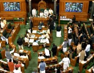 LS adjourned till 12 pm amid oppn protests on Adani issue